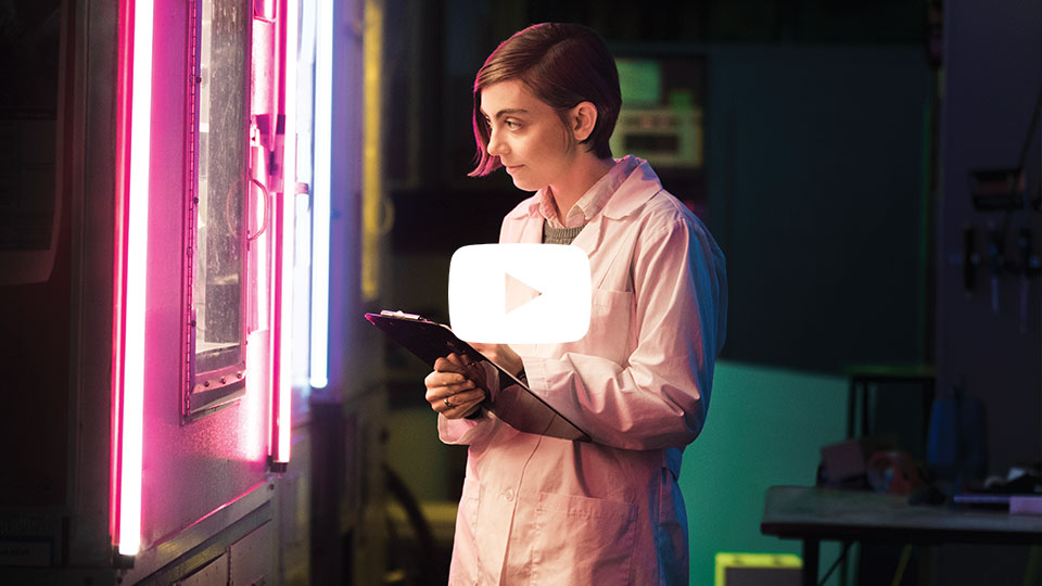 student examining plants