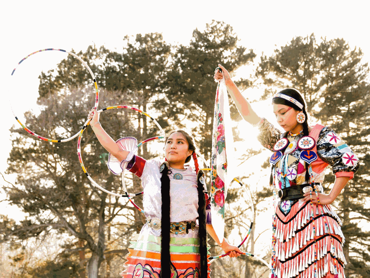 Native American Student Council members posing in Powwow attire.