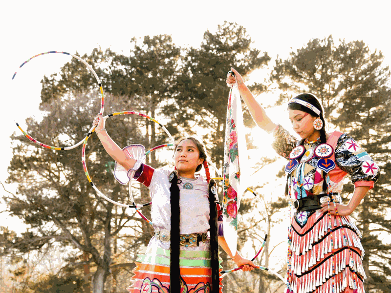 Native American Student Council members posing in Powwow attire.
