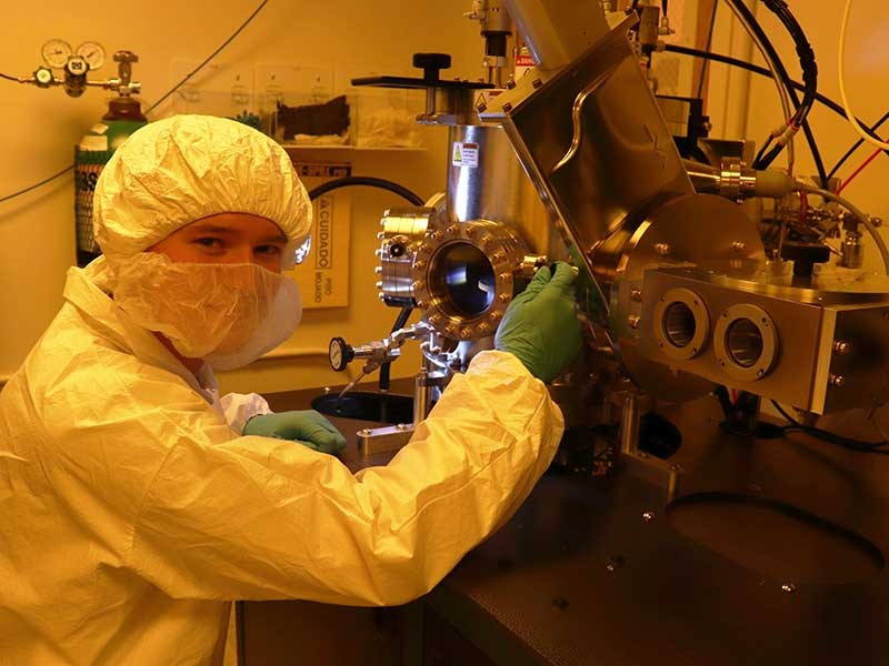 Physicist in cleanroom