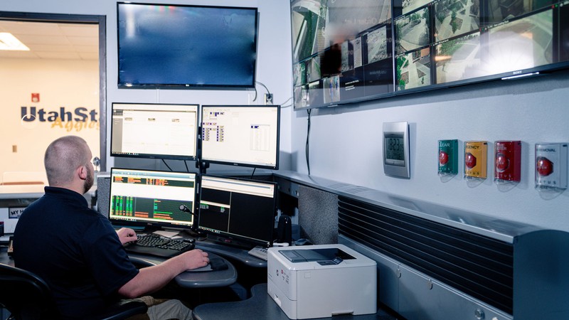 A person in a surveillance room.