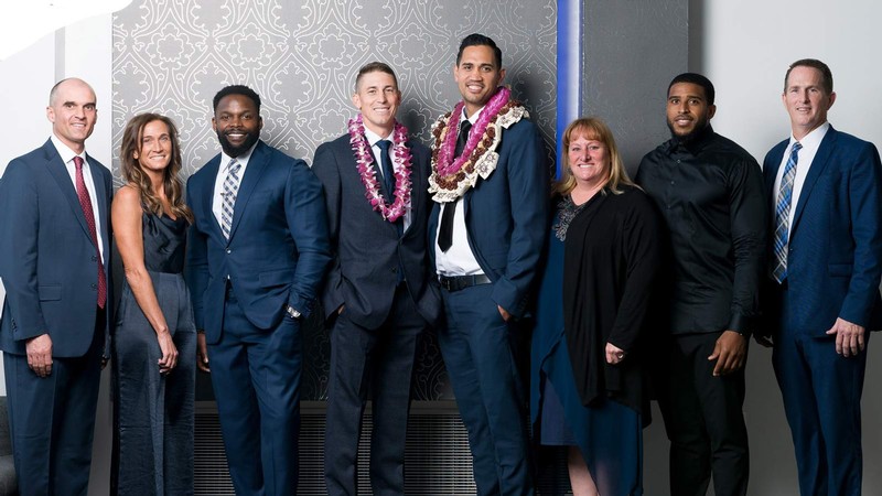 USU Athletics Hall of Fame inductees pose for a picture.