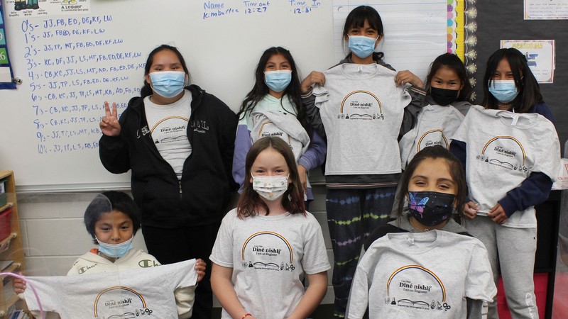 Diné students in Blanding pose with engineering outreach T-shirts.