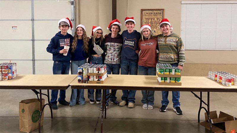 Students and soup cans at a service project.