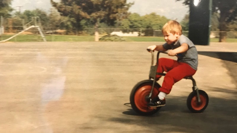 Paul Hill rides a bicycle as a child.