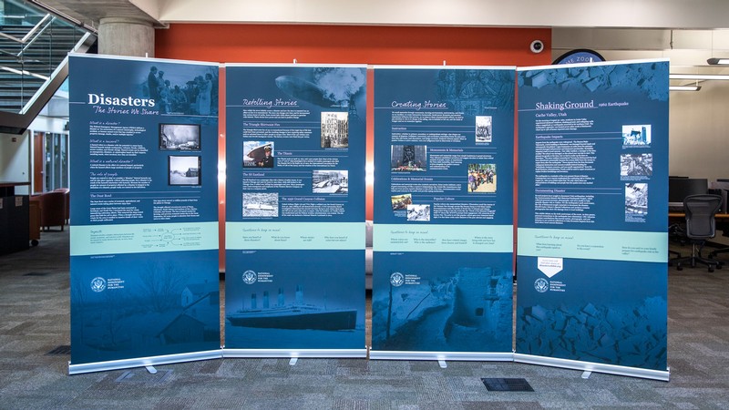 An exhibit on disasters is seen in a library.