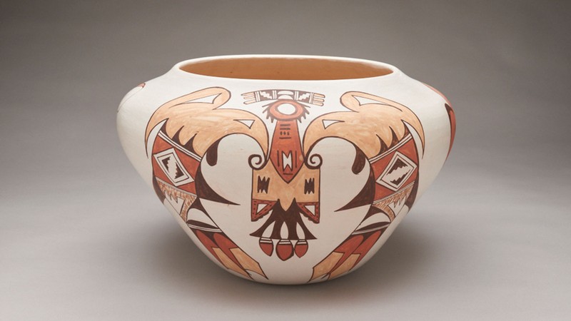 A pottery bowl with a Native American bird design.