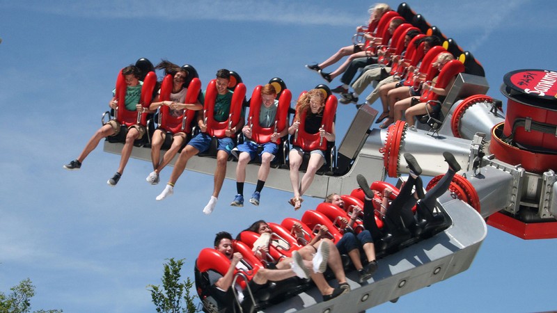 Teens on amusement park ride.