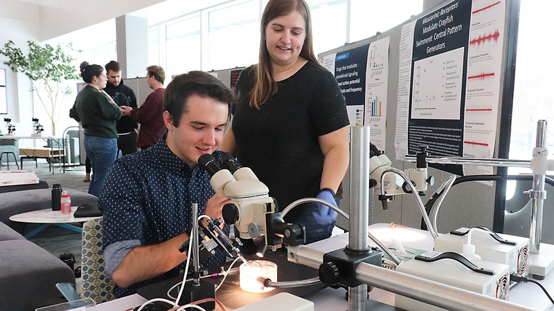 Students using lab equipment.
