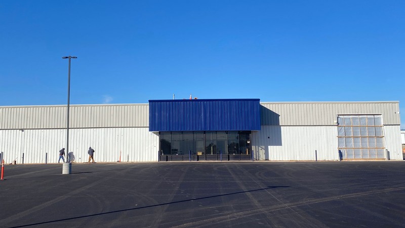 A former department store building repainted in Aggie blue, white and gray.