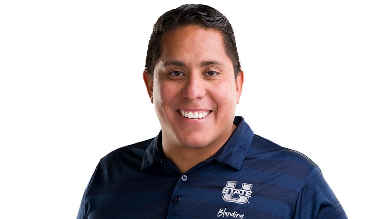 A man poses for a headshot.