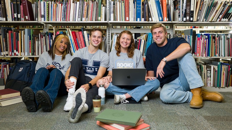 Students sitting in a library.