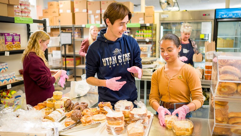 Volunteers work at a food pantry.