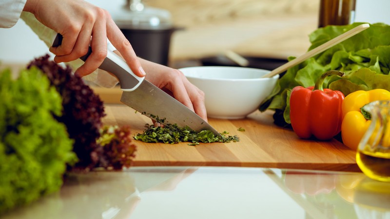 A person chopping vegetables.