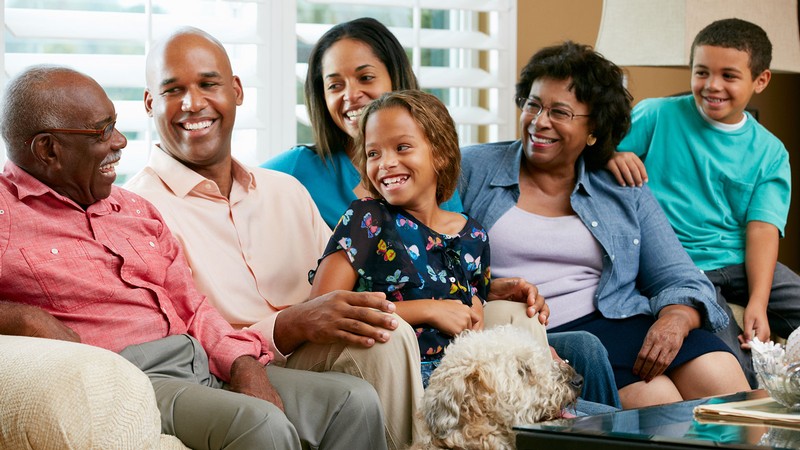 A family talking on a couch.