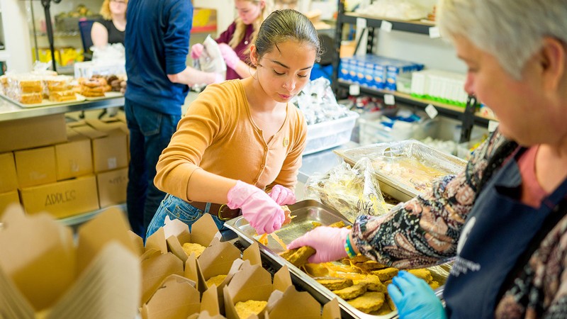 People working in a food pantry.