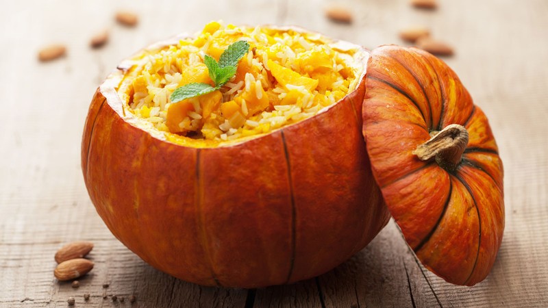 Pumpkin risotto inside a hollowed pumpkin bowl.