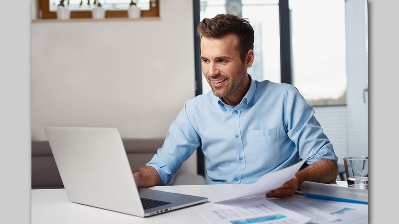 A person working at a laptop.