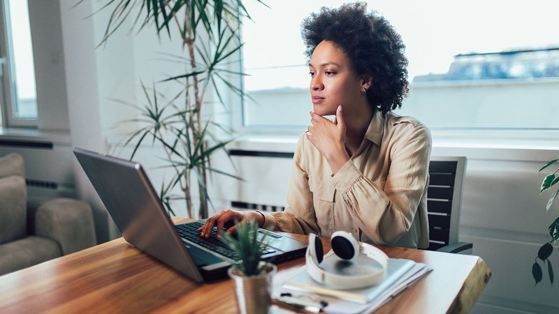 A person working at a laptop.