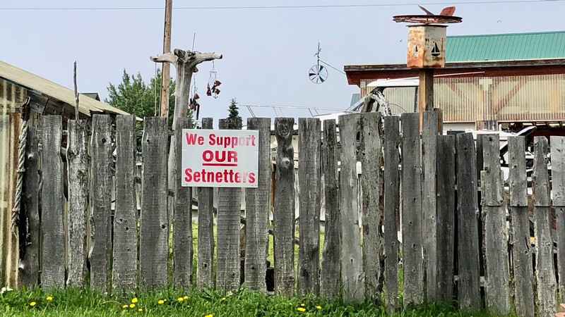 A sign on a fence in Alaska reads "We support our setnetters."