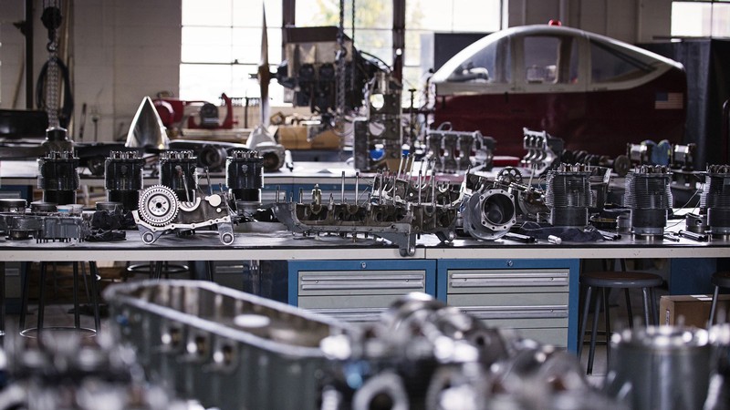 Airplane engine parts on a workbench.