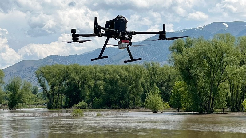 A drone hovering over the Logan River.