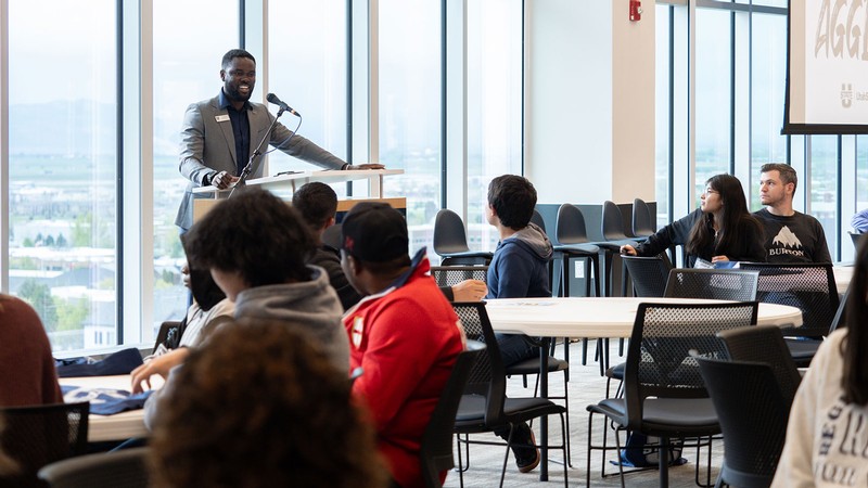 Cyril Mensah speaks to a group of students.