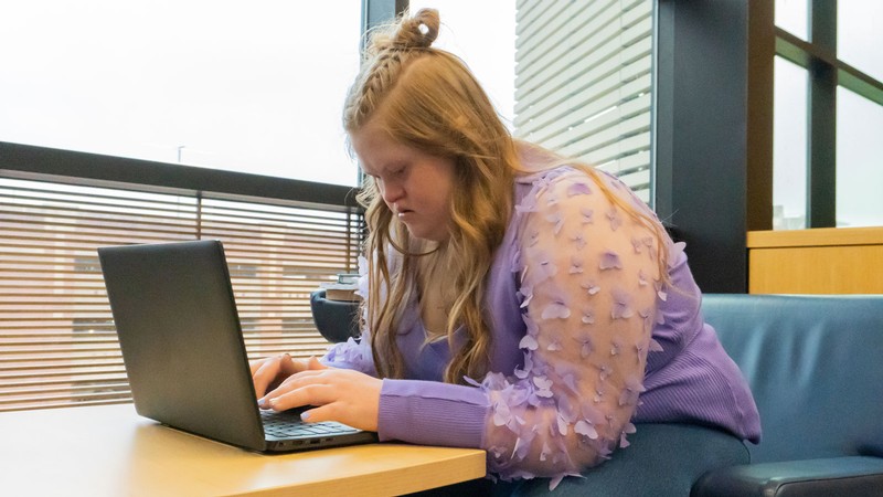 A person using a laptop.