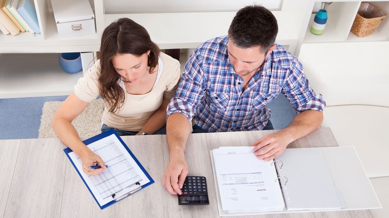 Two people working on a budget.