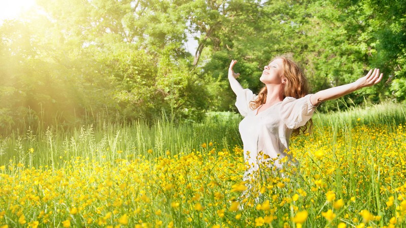 A person basking in a sunny meadow.
