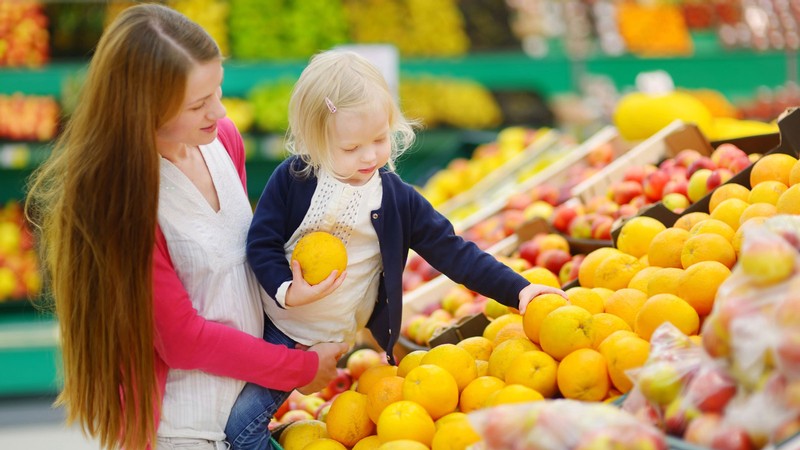 A person shopping with a child.