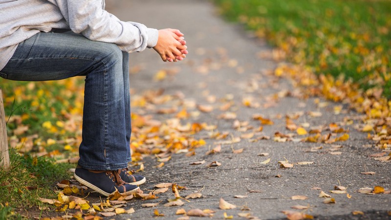 A person holding their hands in thought.