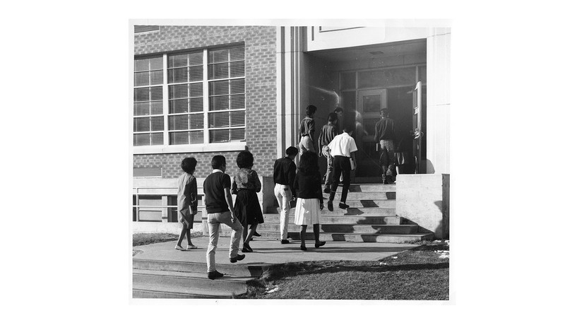 Students entering a school.