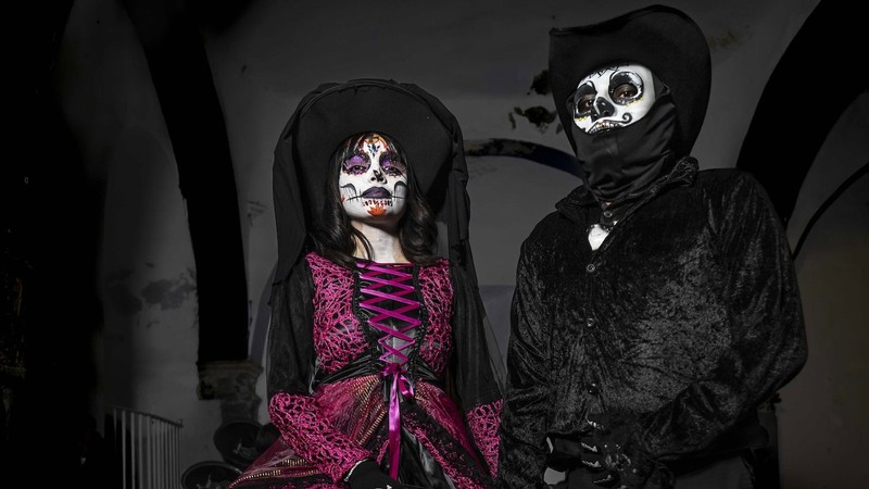People in costume for Dia de Los Muertos.
