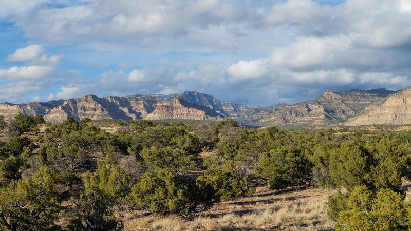 A landscape photograph of rugged cliffs.