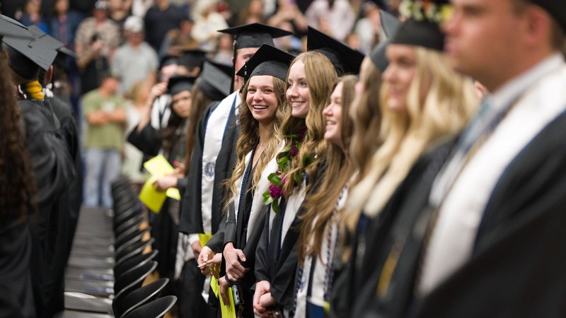 Students in graduation robes.