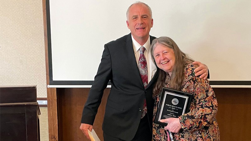Judy Sims receiving an award.