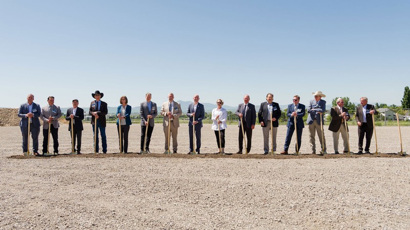 People with shovels posing for a photograph.