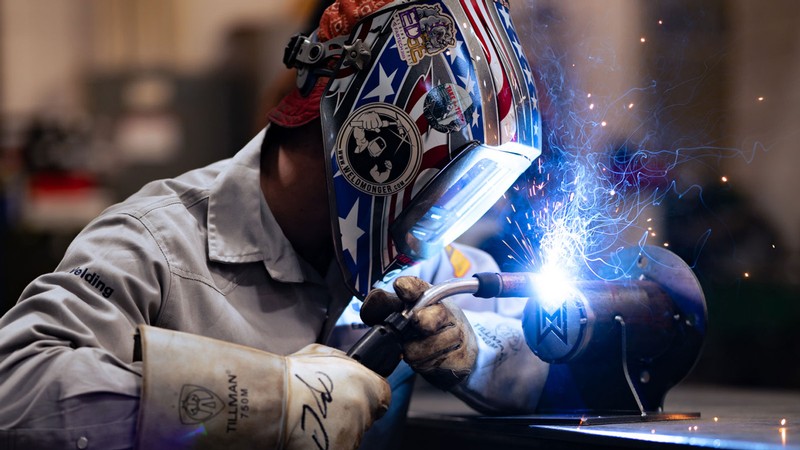 Ben Cornaby wearing a mask while welding.
