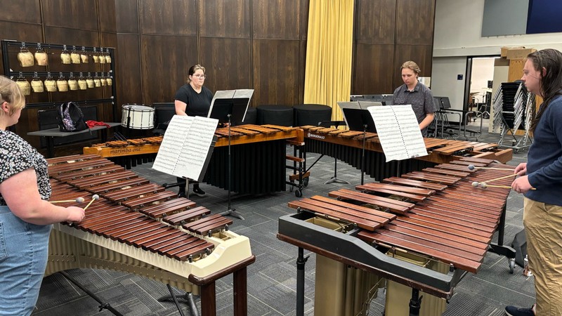 Percussionists practicing in a music room.