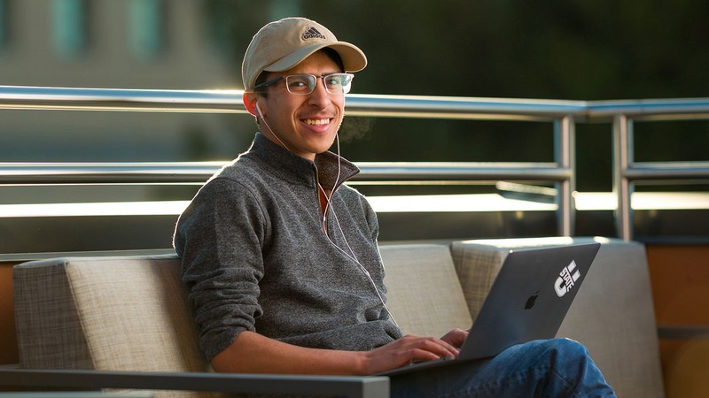 A person using a laptop.
