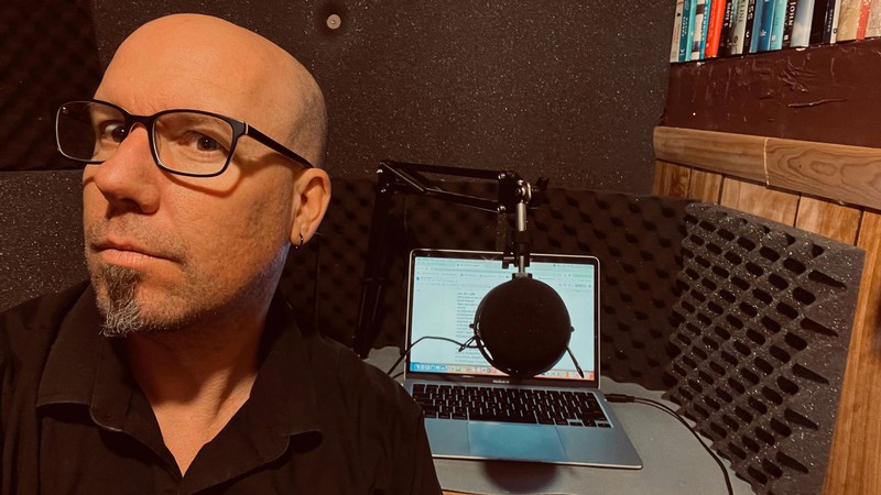 Matthew LaPlante in a podcasting studio.