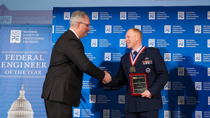 Brigham Moore receiving an award.