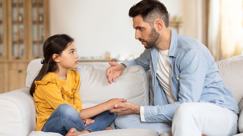 A parent speaking with a child.