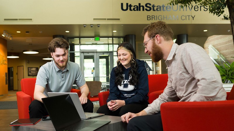 Students speaking with each other on the USU Brigham City campus.