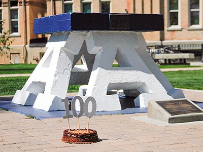 USU's iconic Block 'A' with its 100th birthday cake