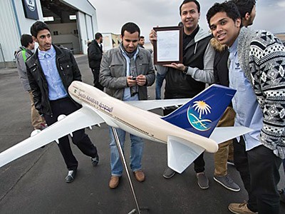 USU aviation students with a Boeing airplane model