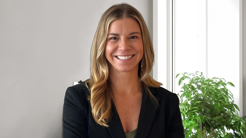 A woman poses for a headshot.