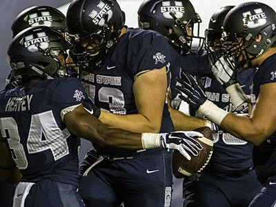 Aggie football players celebrating