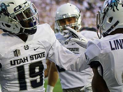 Utah State football players on the field